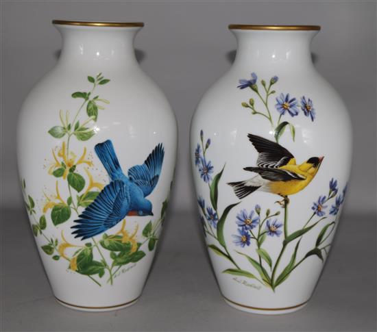 A pair of bird decorated vases and six Royal Doulton collectors plates